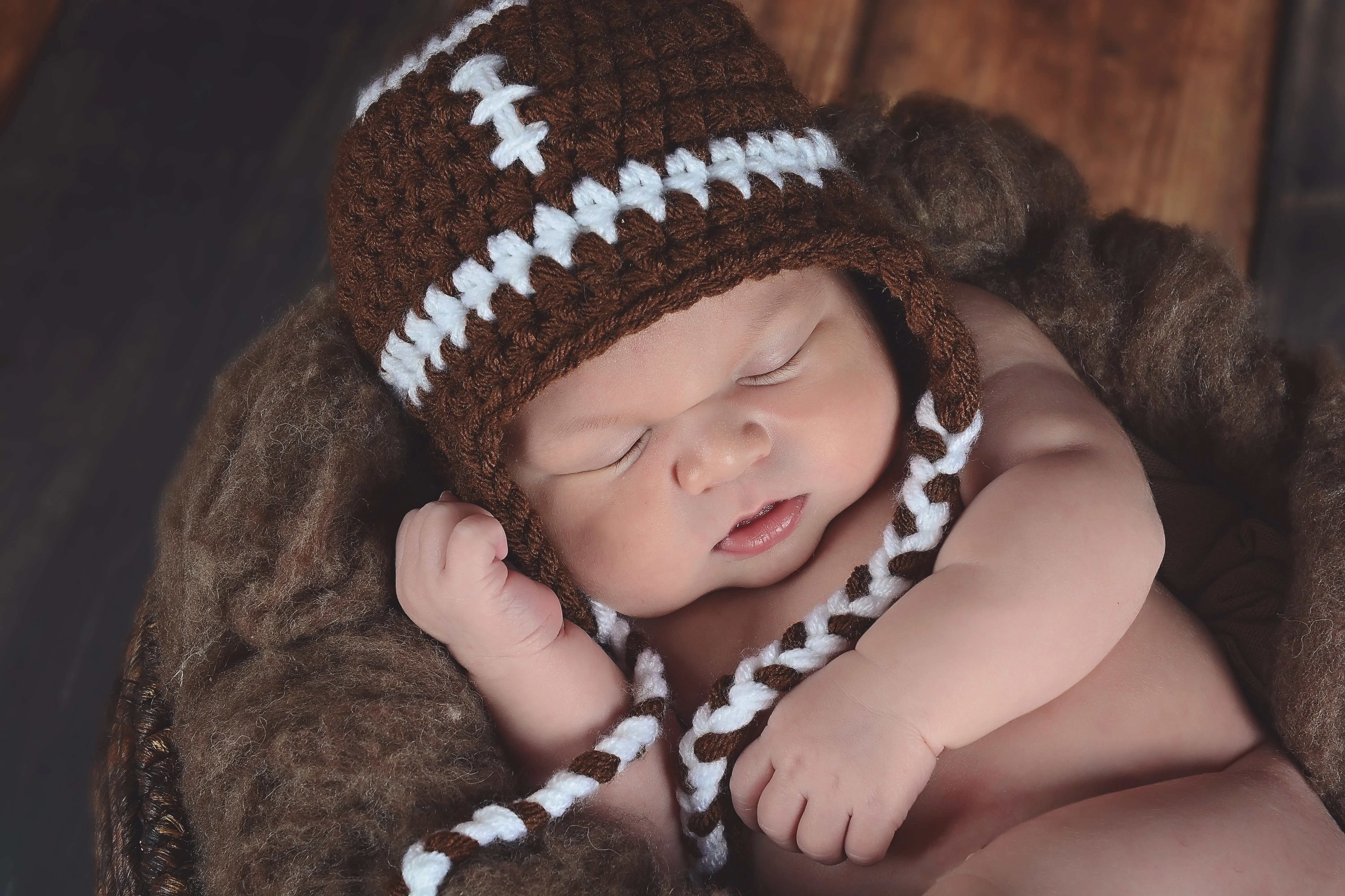 Brown & white football earflap hat